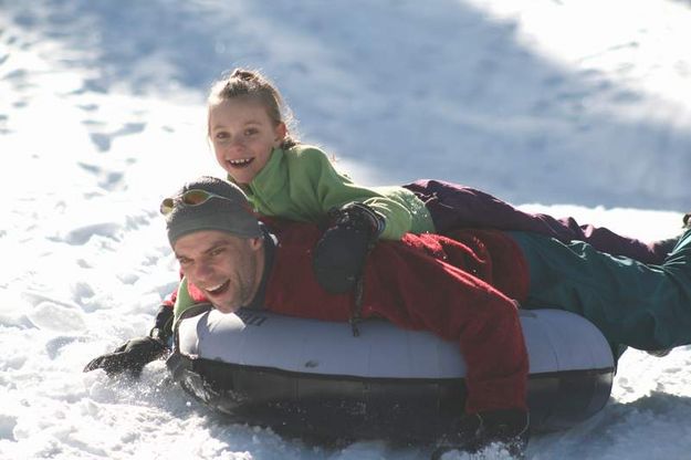 Olivia hitches a ride with dad Eric. Photo by LibbyMT.com.