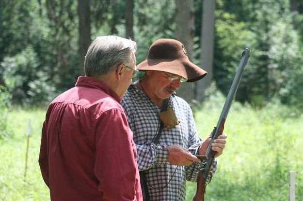 Discussing black powder shooting. Photo by LibbyMT.com.