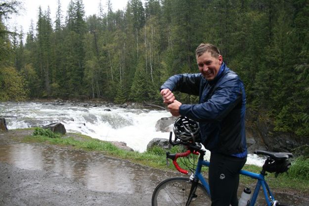 Wringing out the hat at Yaak Falls. Photo by LibbyMT.com.