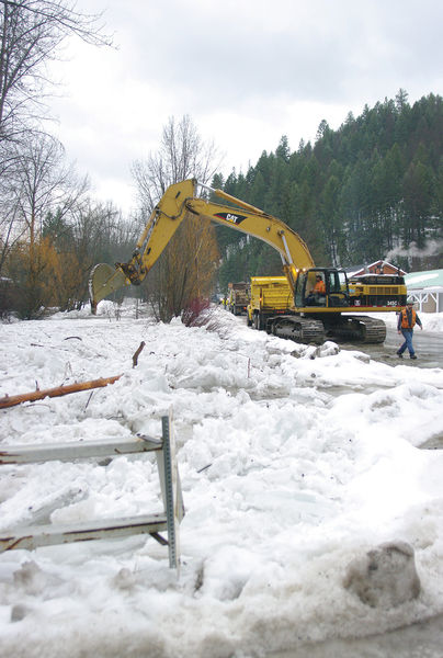 Digging out the ice dam. Photo by Kootenai Valley Record.