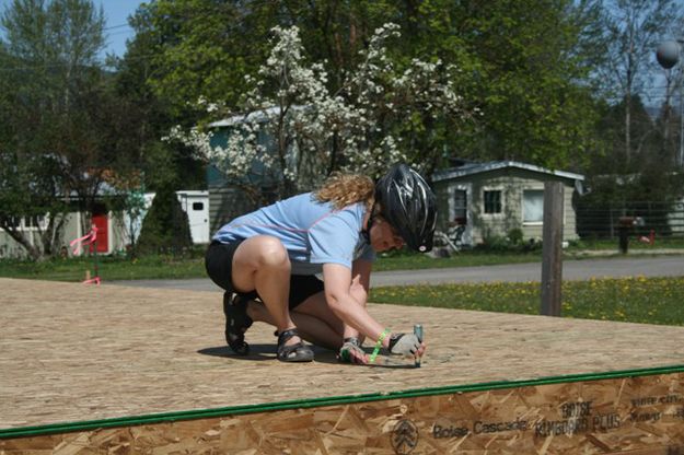 Barb Stuebing signs the Habitat House floor. Photo by LibbyMT.com.