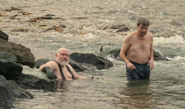 Rick soaks while Steve takes the plunge. Photo by LibbyMT.com.