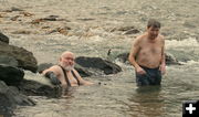 Rick soaks while Steve takes the plunge. Photo by LibbyMT.com.