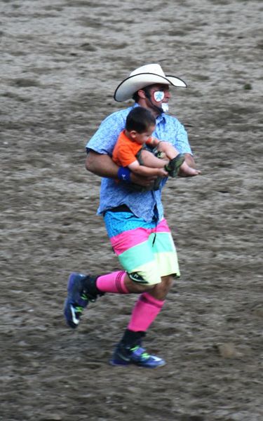 Josh helps a little one. Photo by LibbyMT.com.