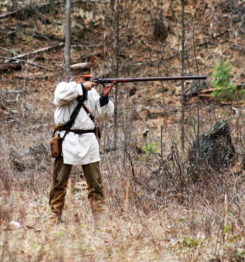 Taking aim with a long rifle. Photo by LibbyMT.com.