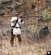 Taking aim with a long rifle. Photo by LibbyMT.com.