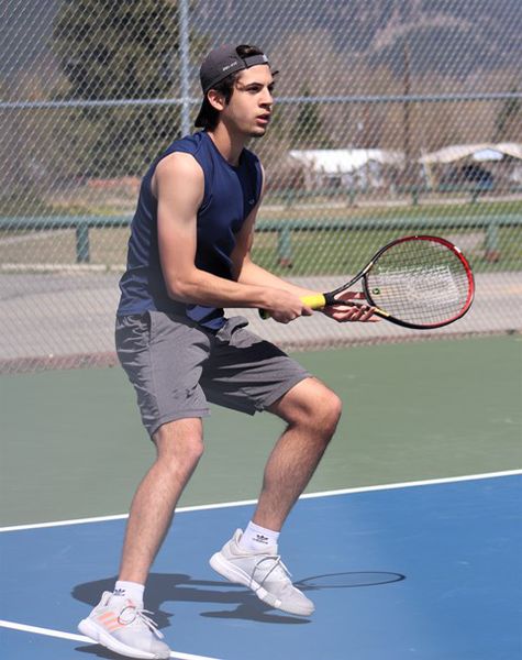 Playing tennis. Photo by LibbyMT.com.