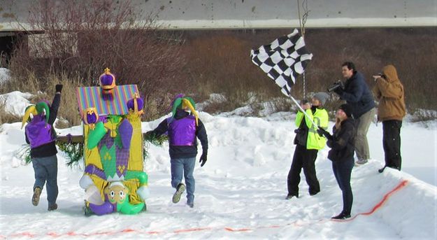 Taking the checkered flag. Photo by LibbyMT.com.