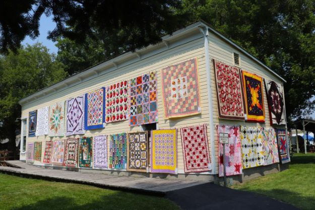 Covered in quilts. Photo by LibbyMT.com.