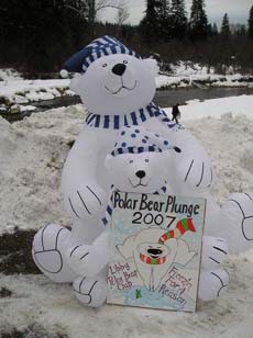 Polar Bear Rick enjoys a plunge in Libby Creek